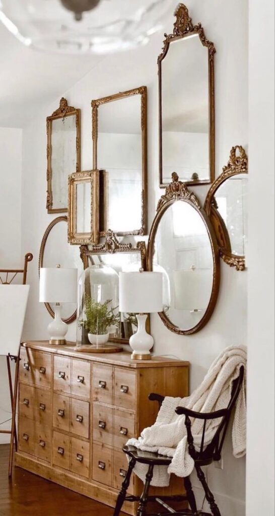 pairing a vintage jharokha mirror with an wooden console table for a more earthy and grounded look with monochromatic white and gold accents